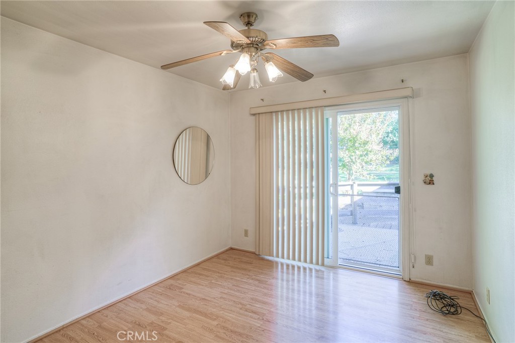 1361 Mt Ida Road Oroville, CA 95966 - Photo 22 of 44 a view of a room with wooden floor and fan