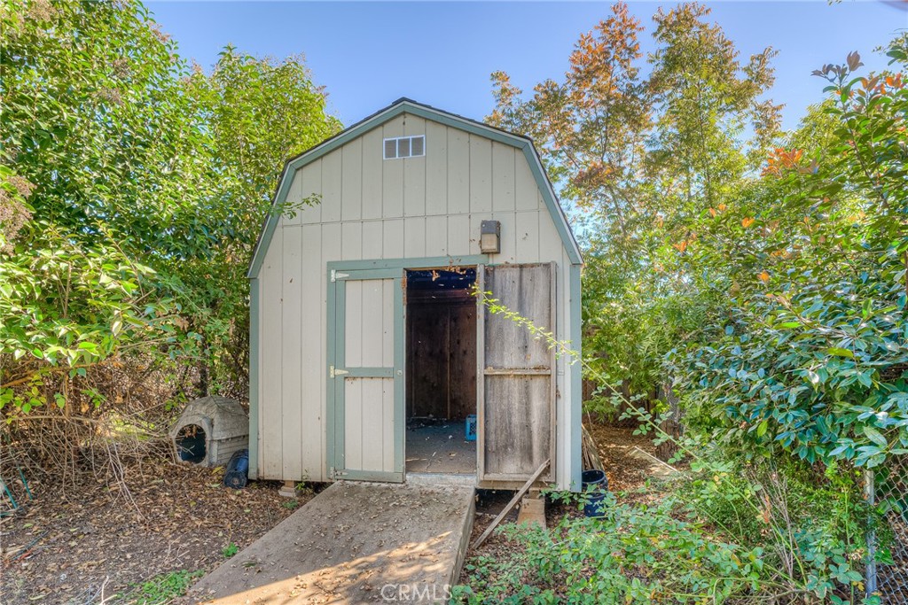 1361 Mt Ida Road Oroville, CA 95966 - Photo 33 of 44 a view of a small house with plants and trees