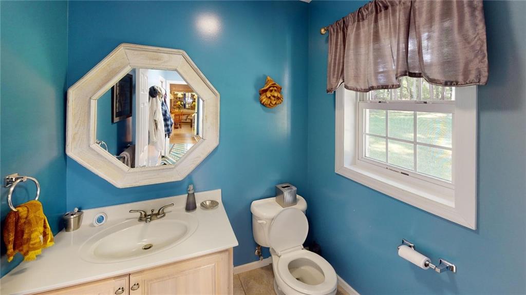 123 Hunt Road Butler, PA 16001 - Photo 17 of 44 a bathroom with a sink a toilet and a mirror