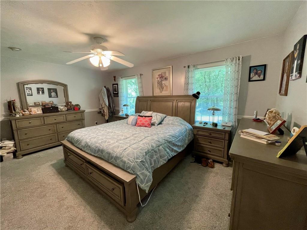 123 Hunt Road Butler, PA 16001 - Photo 19 of 44 a bedroom with a bed and a chandelier