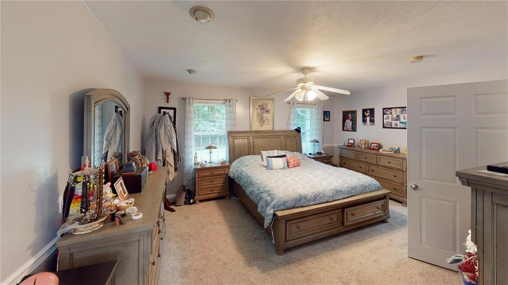 123 Hunt Road Butler, PA 16001 - Photo 20 of 44 a bed sitting in a bedroom next to a window