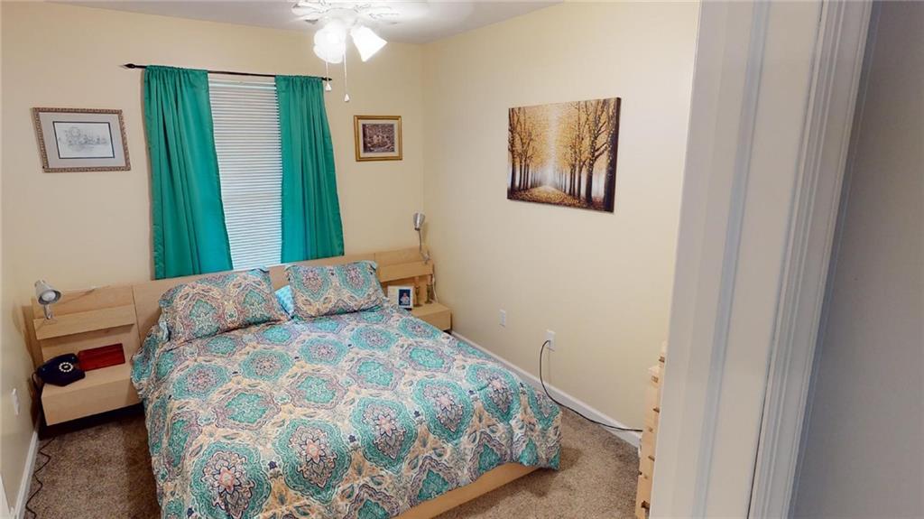 123 Hunt Road Butler, PA 16001 - Photo 23 of 44 a bedroom with a large bed and a mirror