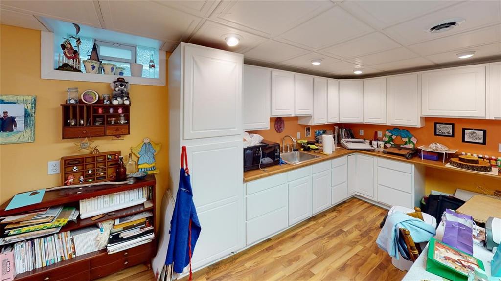 123 Hunt Road Butler, PA 16001 - Photo 31 of 44 a room with furniture and a book shelf