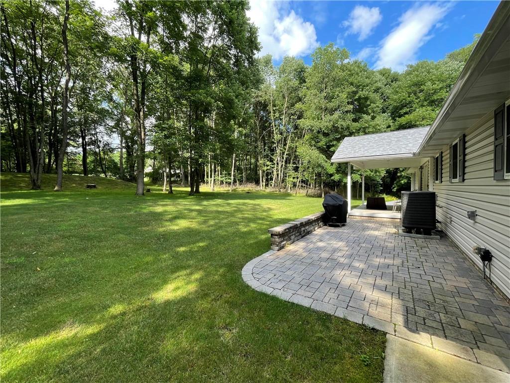 123 Hunt Road Butler, PA 16001 - Photo 39 of 44 a view of a park with large trees and a barn
