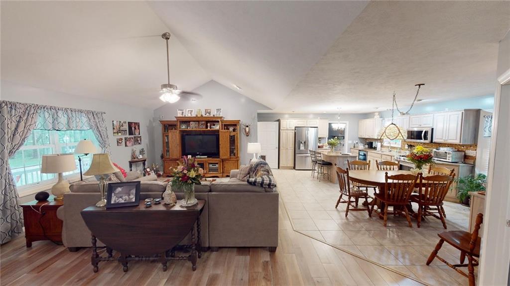 123 Hunt Road Butler, PA 16001 - Photo 4 of 44 a living room with furniture and a chandelier