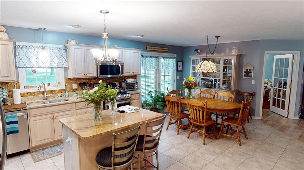 123 Hunt Road Butler, PA 16001 - Photo 6 of 44 a dining room with furniture a window and kitchen view