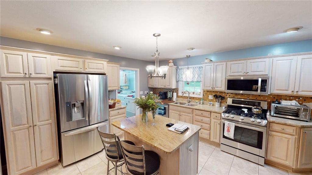123 Hunt Road Butler, PA 16001 - Photo 7 of 44 a kitchen with stainless steel appliances a stove refrigerator sink and microwave