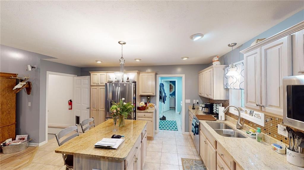 123 Hunt Road Butler, PA 16001 - Photo 8 of 44 a kitchen with sink refrigerator and microwave