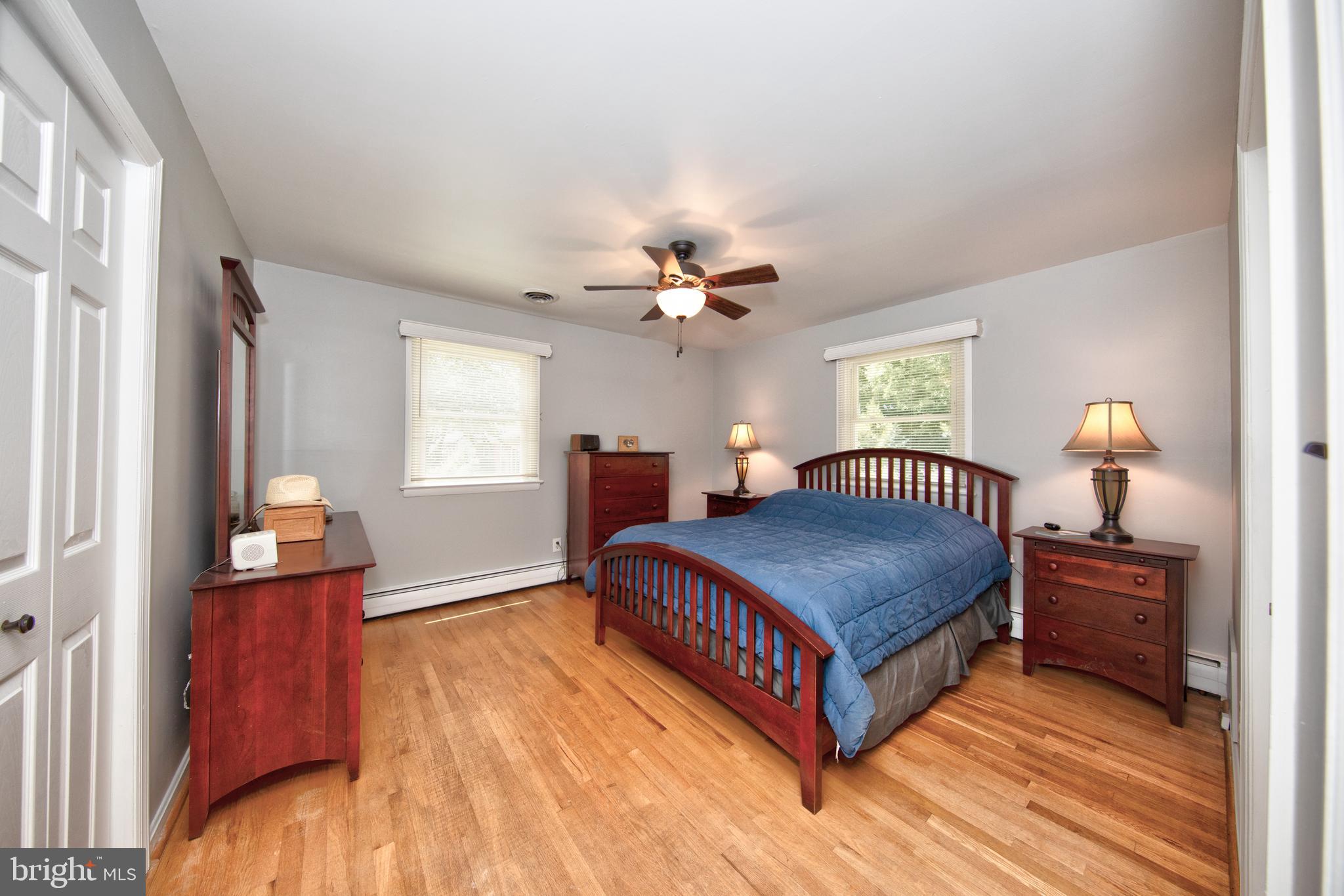 214 W Road Essex, MD 21221 - Photo 15 of 33 Primary bedroom with beautiful hardwood floors