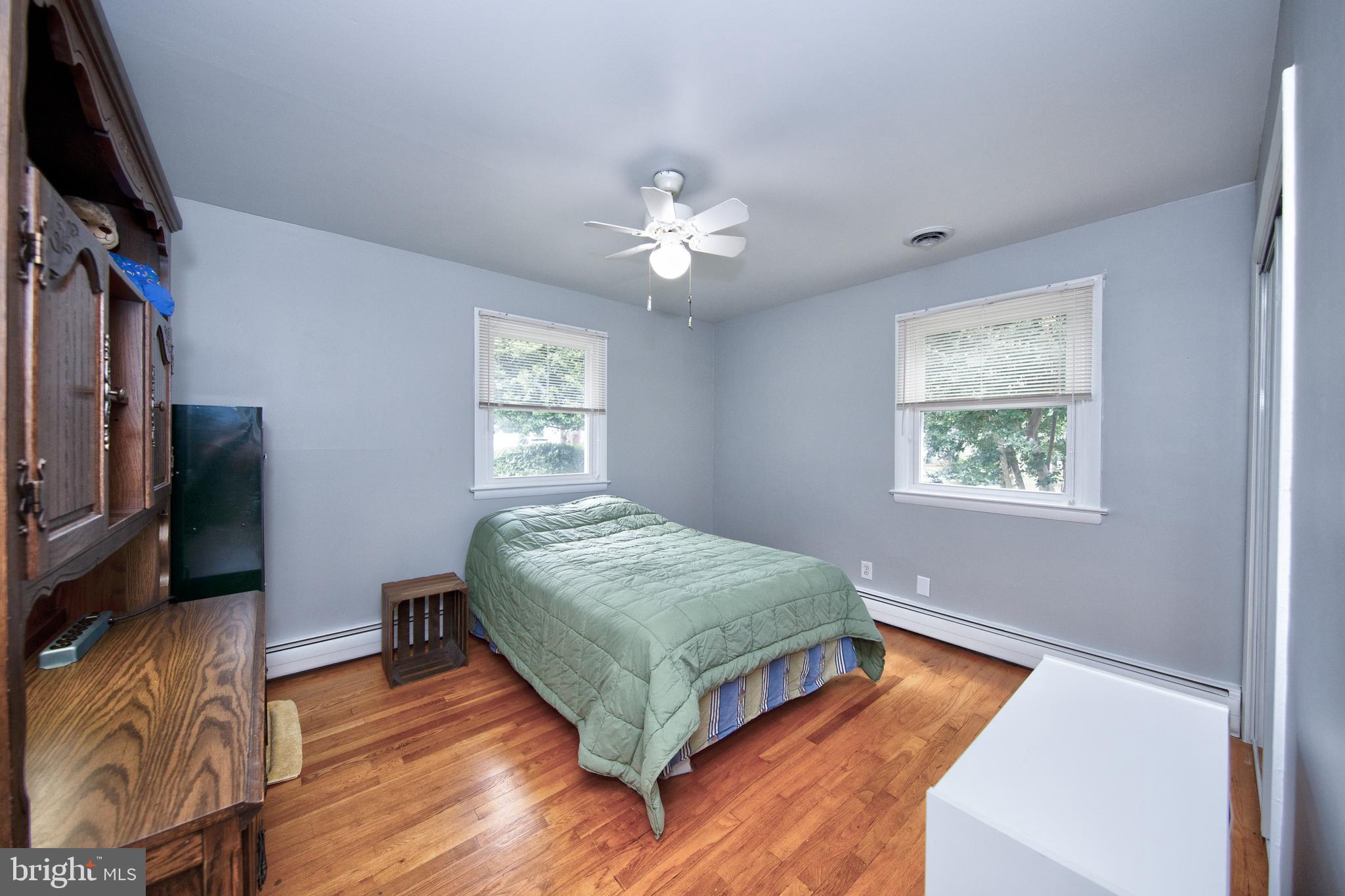 214 W Road Essex, MD 21221 - Photo 16 of 33 Second bedroom with hardwood floors
