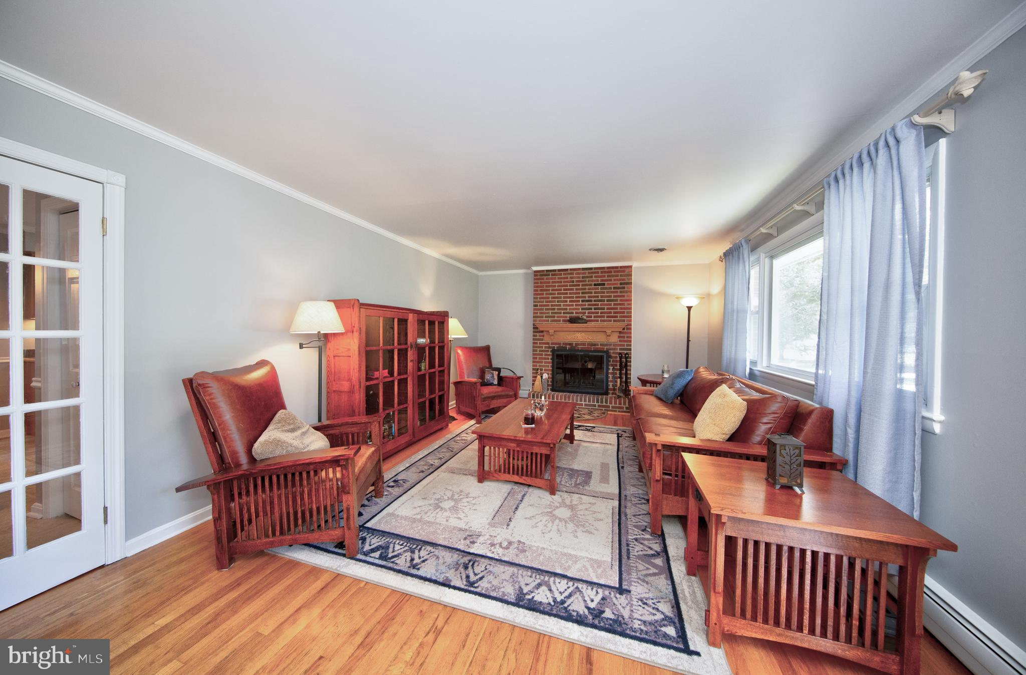 214 W Road Essex, MD 21221 - Photo 3 of 33 Living room with brick fireplace