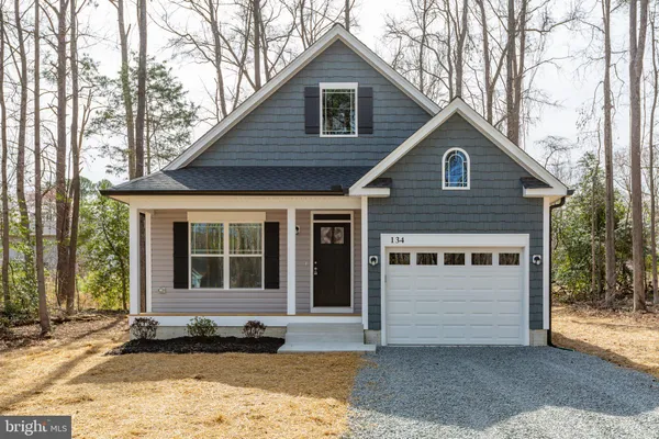 a front view of a house with a garage