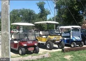 a couple of cars parked in front of a house