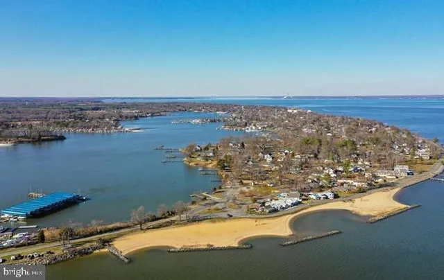 an aerial view of a house with a lake view