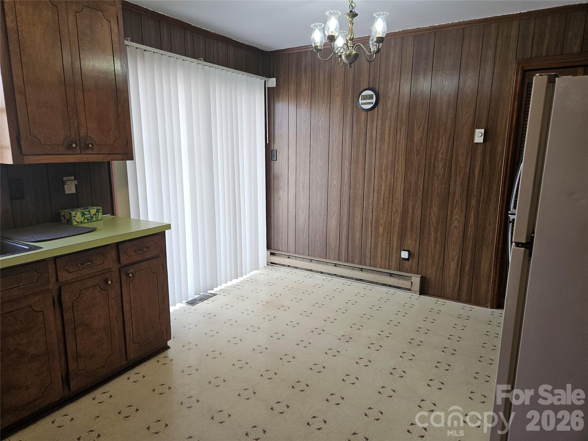 7440 Tuckaseegee Road Kannapolis, NC 28081 - Photo 3 of 17 a bathroom with a granite countertop sink a mirror and shower