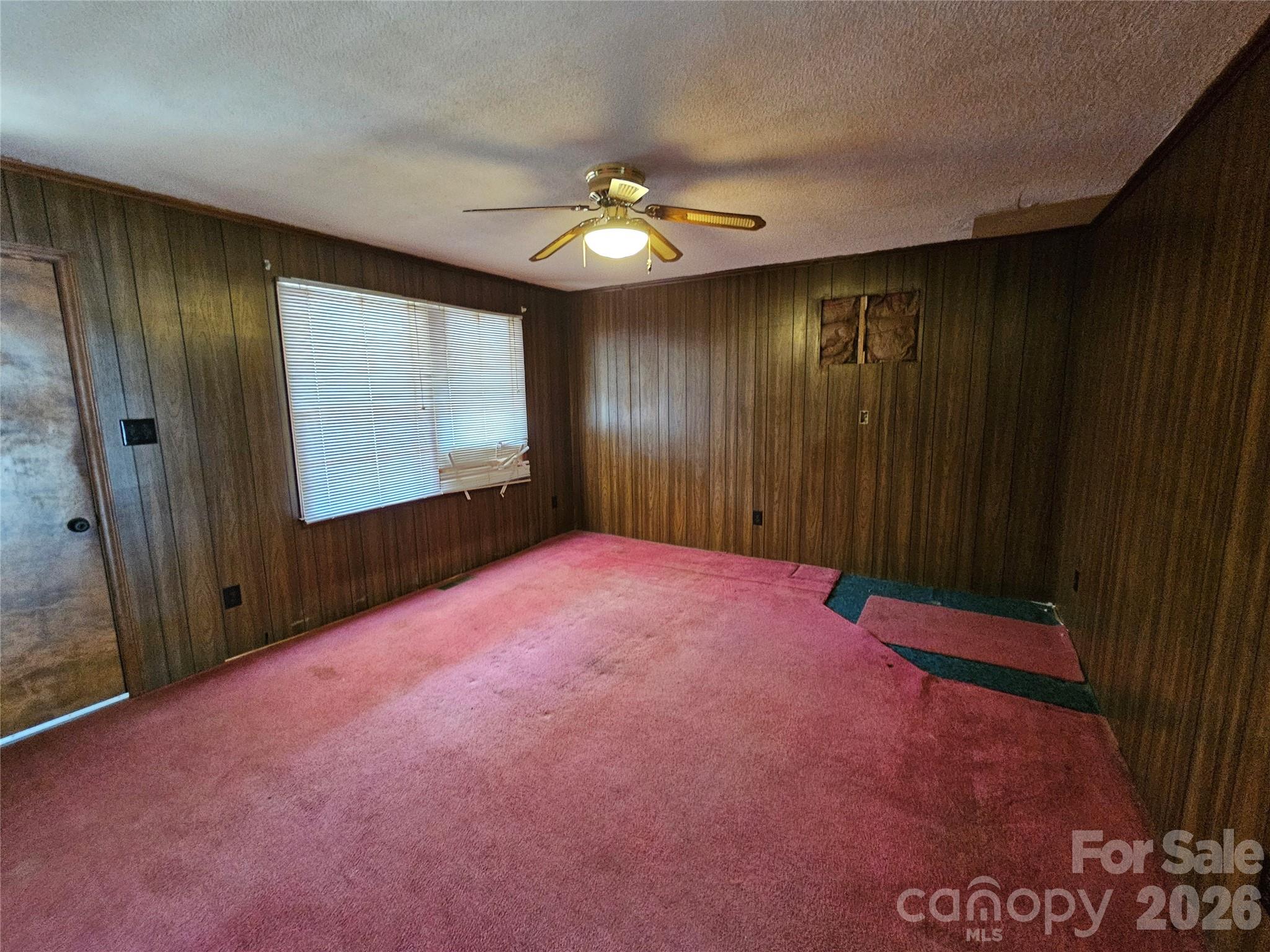 7440 Tuckaseegee Road Kannapolis, NC 28081 - Photo 4 of 17 wooden floor in an empty room with a window