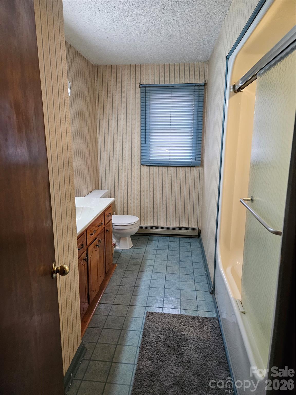 7440 Tuckaseegee Road Kannapolis, NC 28081 - Photo 7 of 17 a bathroom with a sink and a mirror