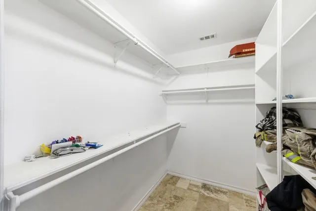 a view of storage and utility room with empty racks