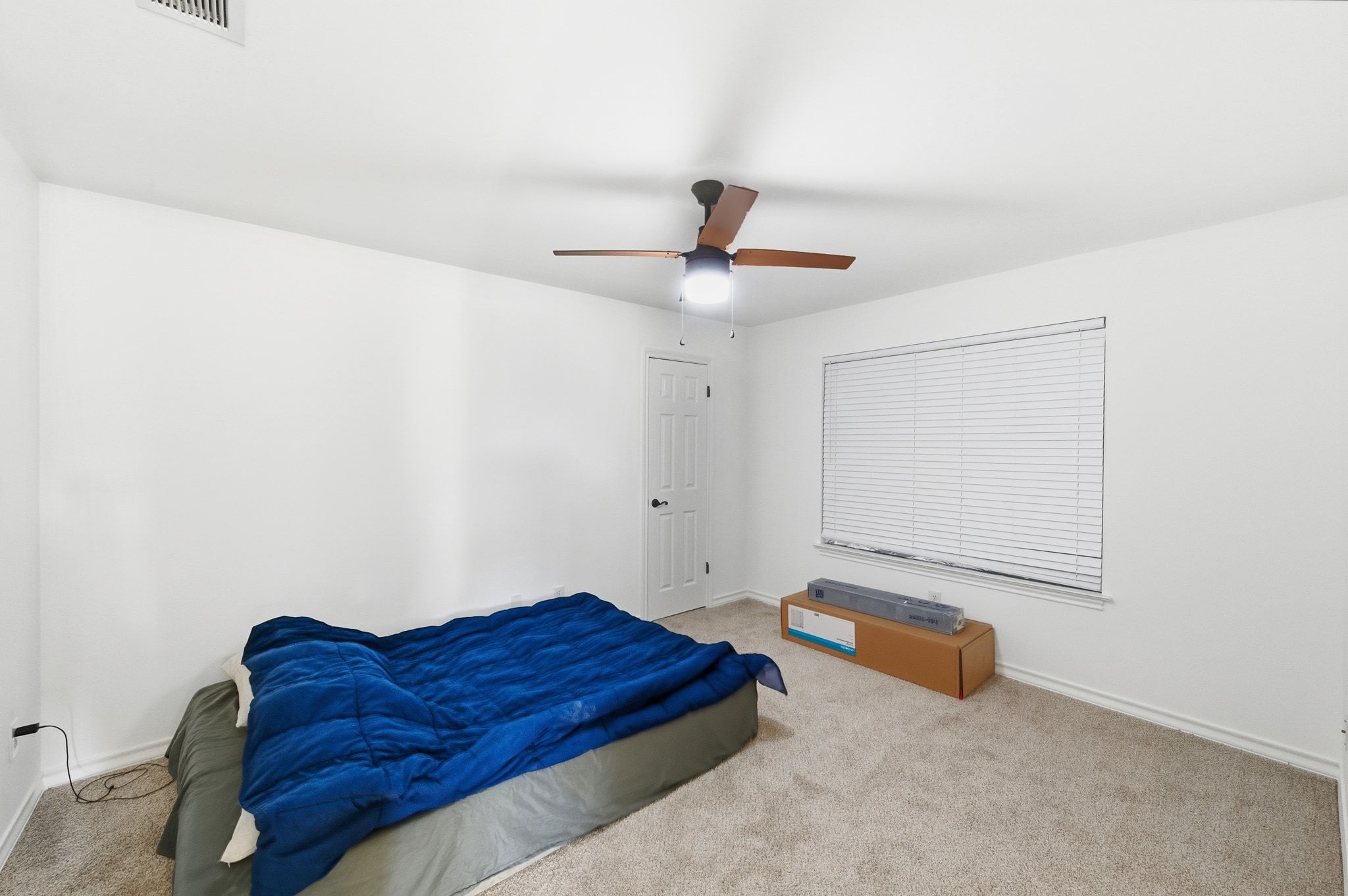 162 Farm To Market 672 Dale, TX 78616 - Photo 20 of 40 Carpeted bedroom featuring a ceiling fan and baseboards