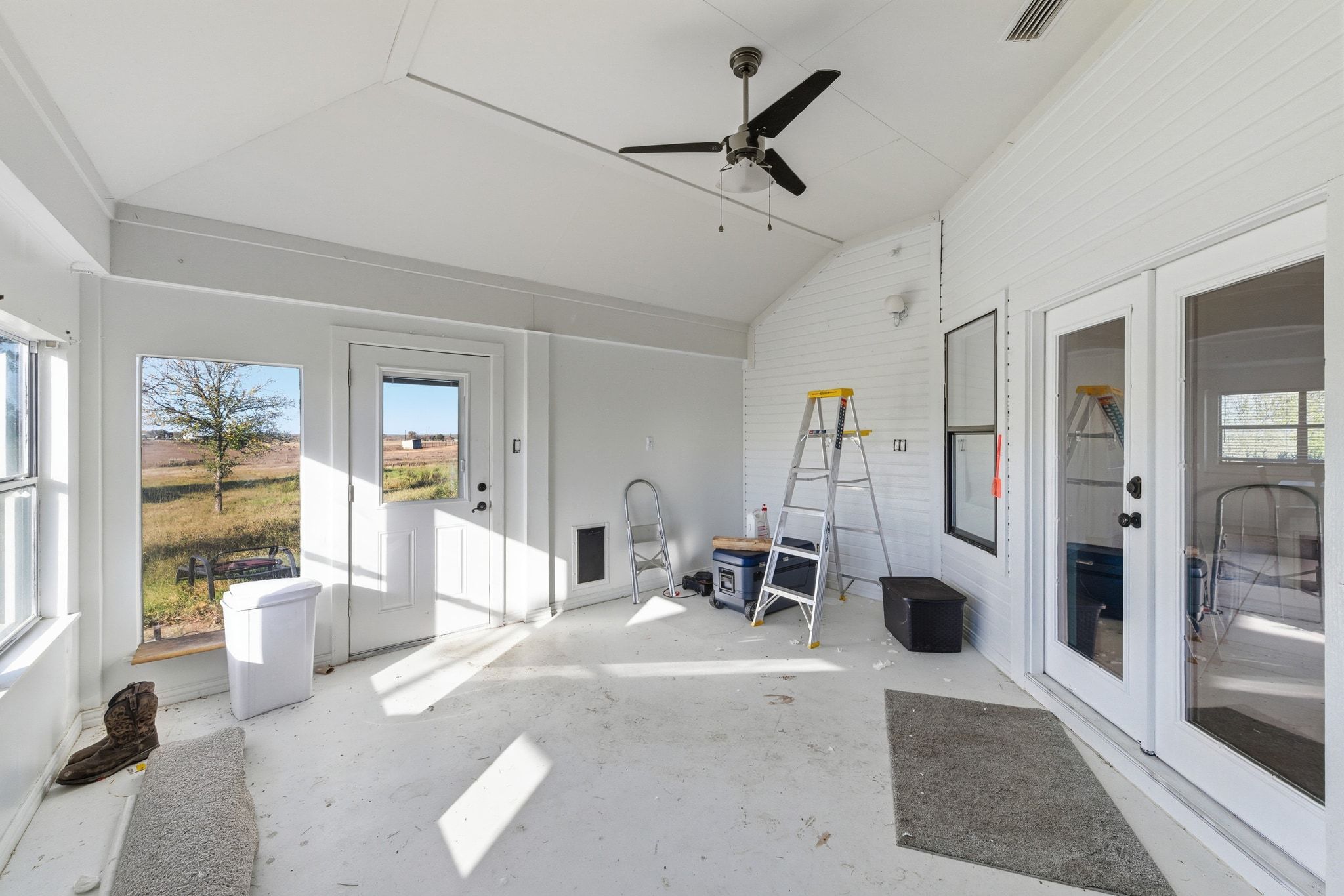 162 Farm To Market 672 Dale, TX 78616 - Photo 26 of 40 Sunroom with lofted ceiling, a ceiling fan, plenty of natural light, and french doors