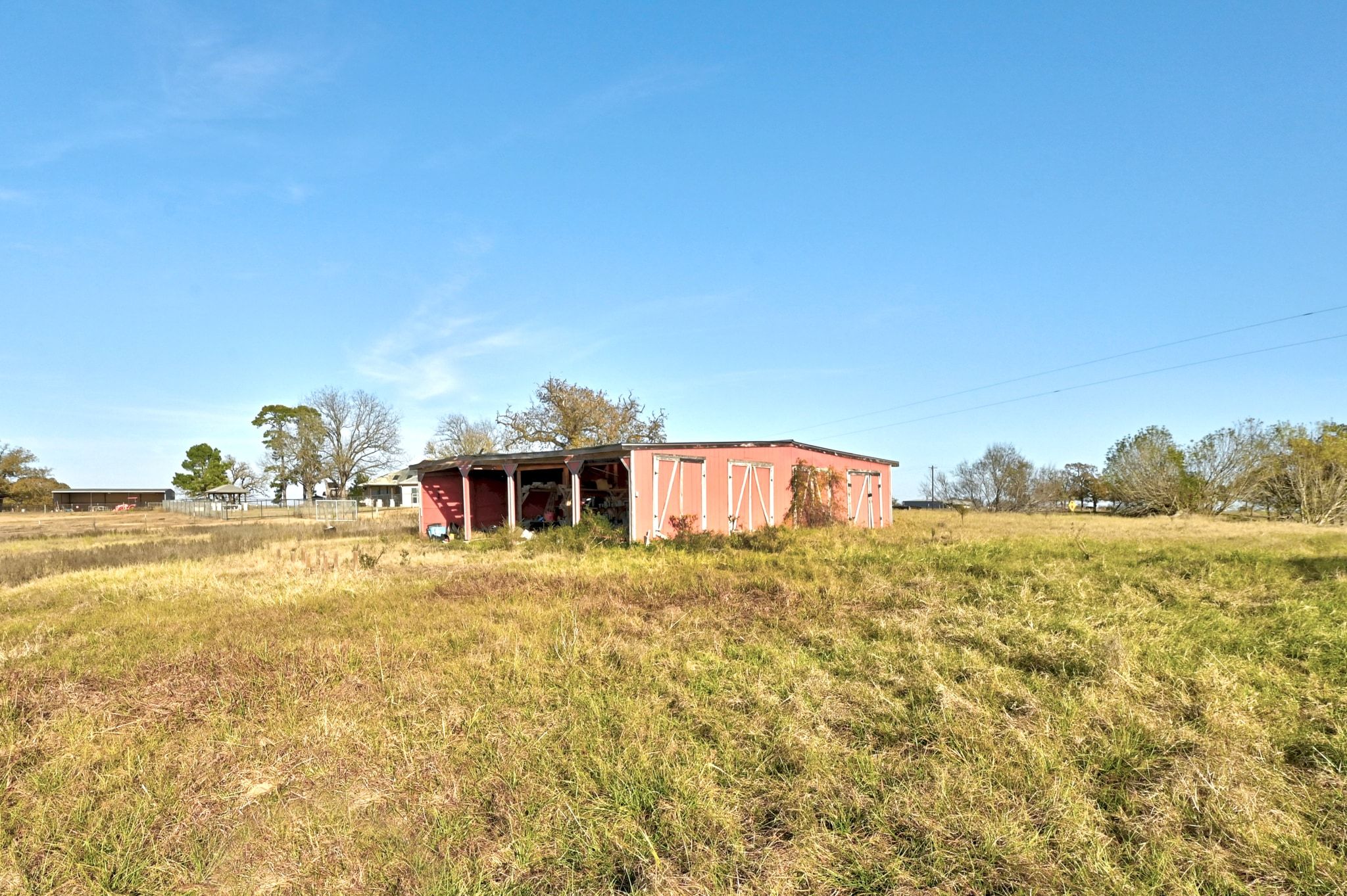 162 Farm To Market 672 Dale, TX 78616 - Photo 30 of 40 View of yard with an outdoor structure, an outbuilding, and a view of countryside