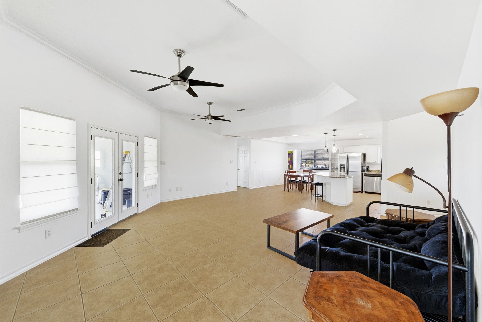 162 Farm To Market 672 Dale, TX 78616 - Photo 6 of 40 Living area featuring french doors, ceiling fan, and light tile patterned floors