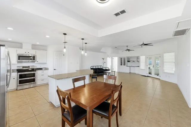 a kitchen with a table and chairs in it