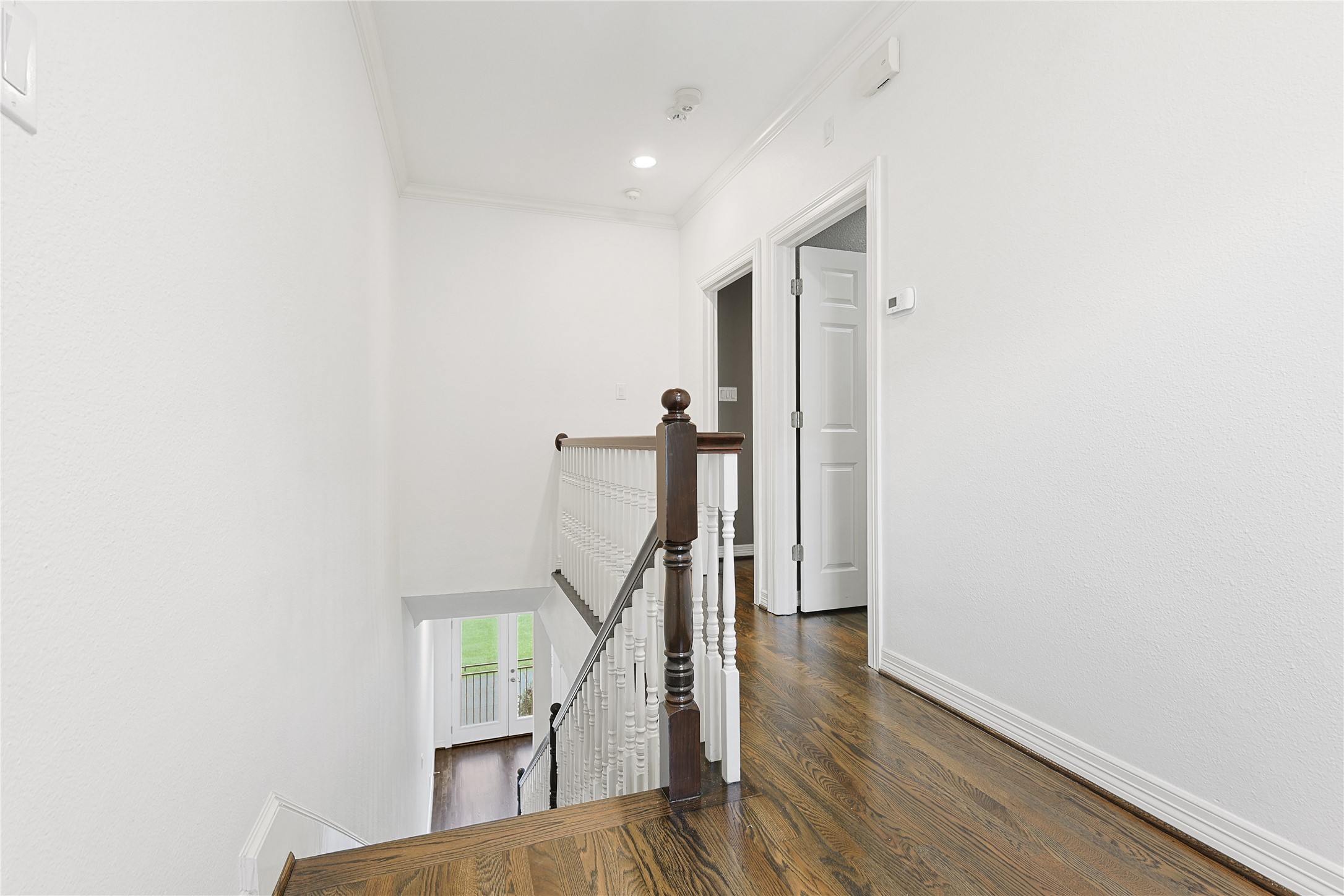801 Knox Street Houston, TX 77007 - Photo 19 of 33 a view of entryway with wooden floor