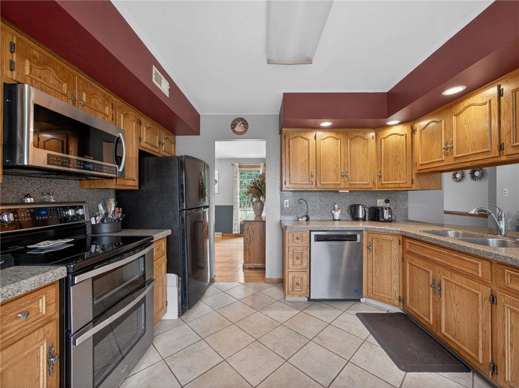 853 Lahr Road Nazareth, PA 18064 - Photo 9 of 29 A well-equipped kitchen features ample cabinetry and stainless steel appliances for daily convenience.