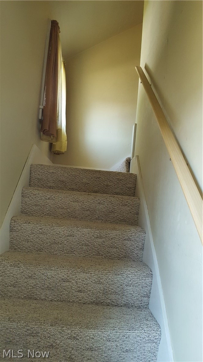 693 Darrow Road Akron, OH 44305 - Photo 26 of 35 Heading up stairs where there is a landing and a nice big window. (this is the only window that is not new). Just a quick turn to the right and you're almost up.
