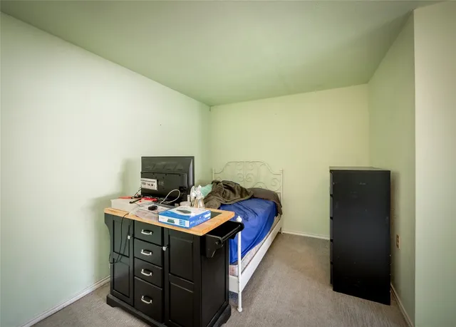 a room with furniture and mirror