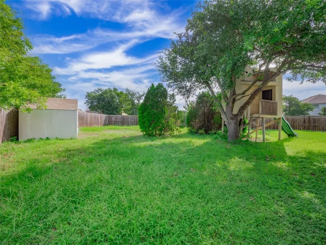 a view of a backyard with a garden