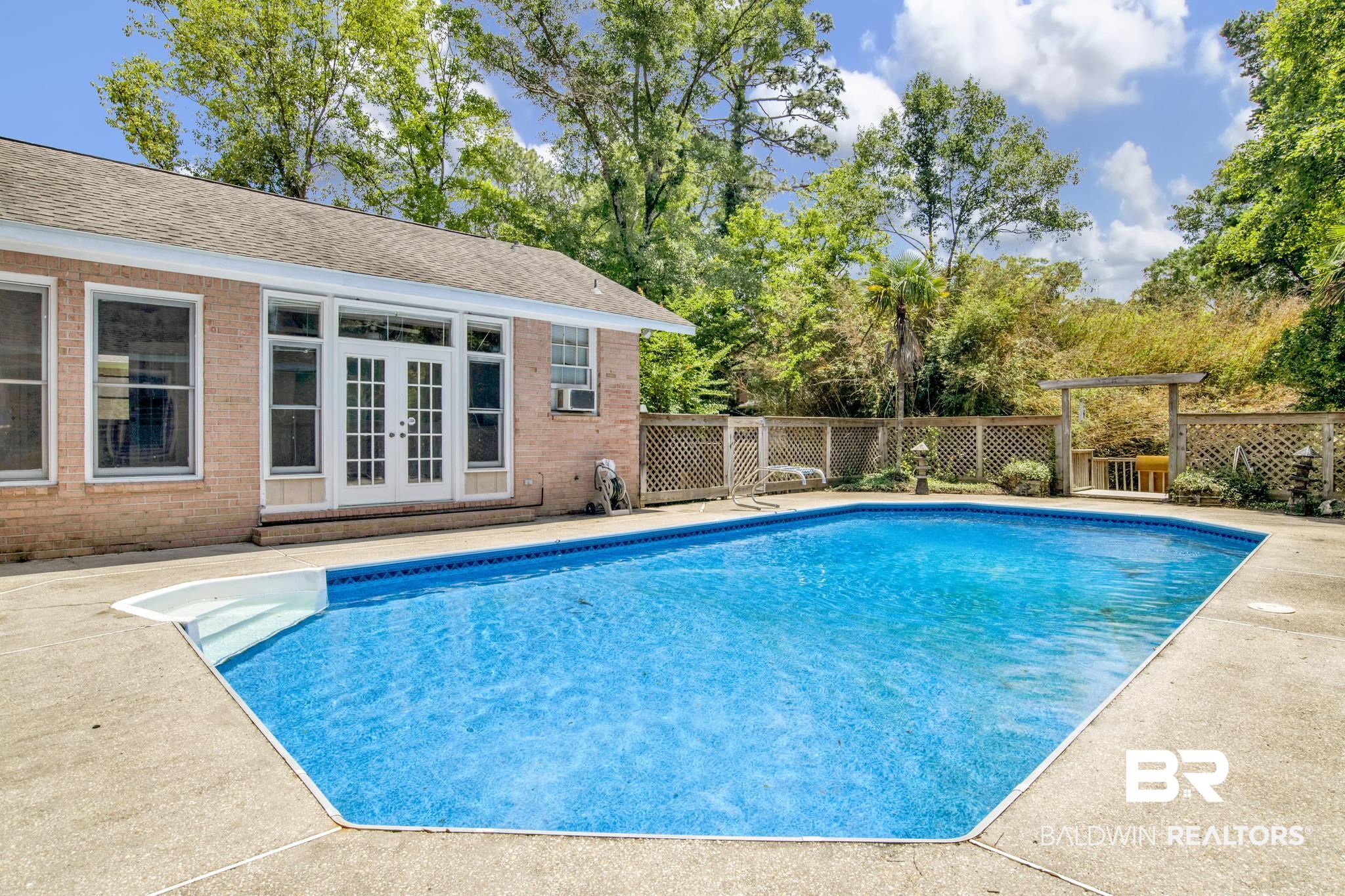 6805 Hunters Court Mobile, AL 36695 - Photo 35 of 37 View of pool featuring french doors and cooling unit