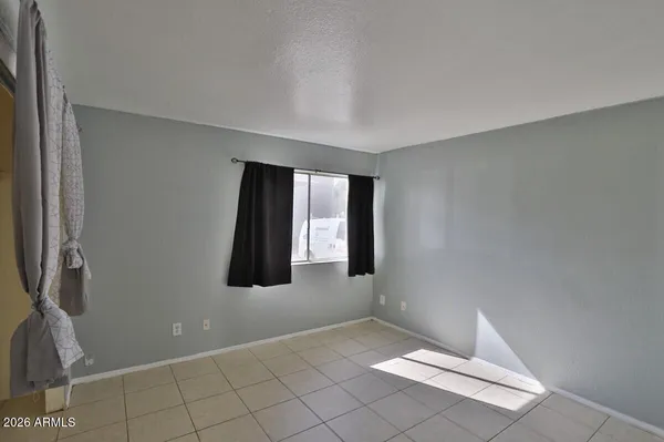 a view of an empty room and window