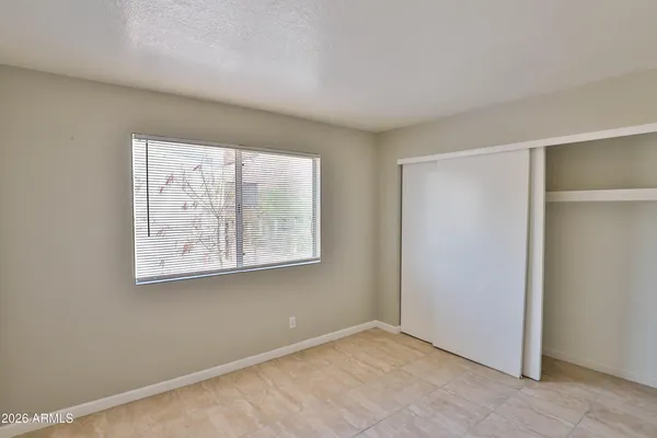 a bathroom with a toilet sink vanity and mirror