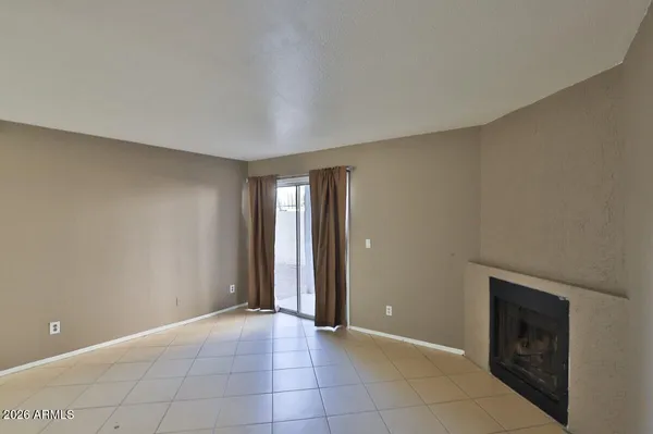 a view of an empty room and window