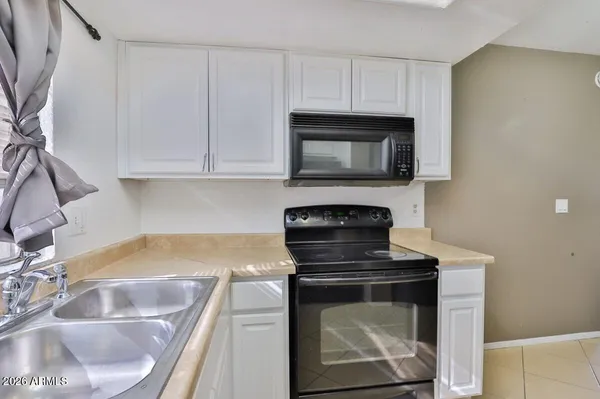 a kitchen with a stove and a microwave