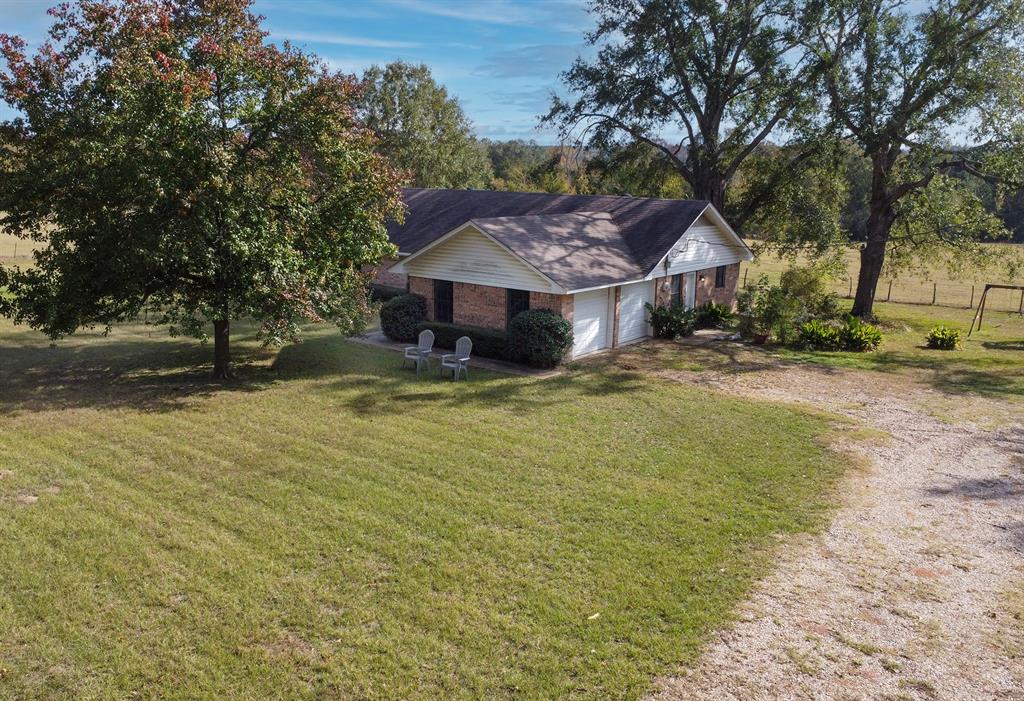 15377 County Road 1134 Tyler, TX 75709 - Photo 12 of 16 a view of a house with a yard