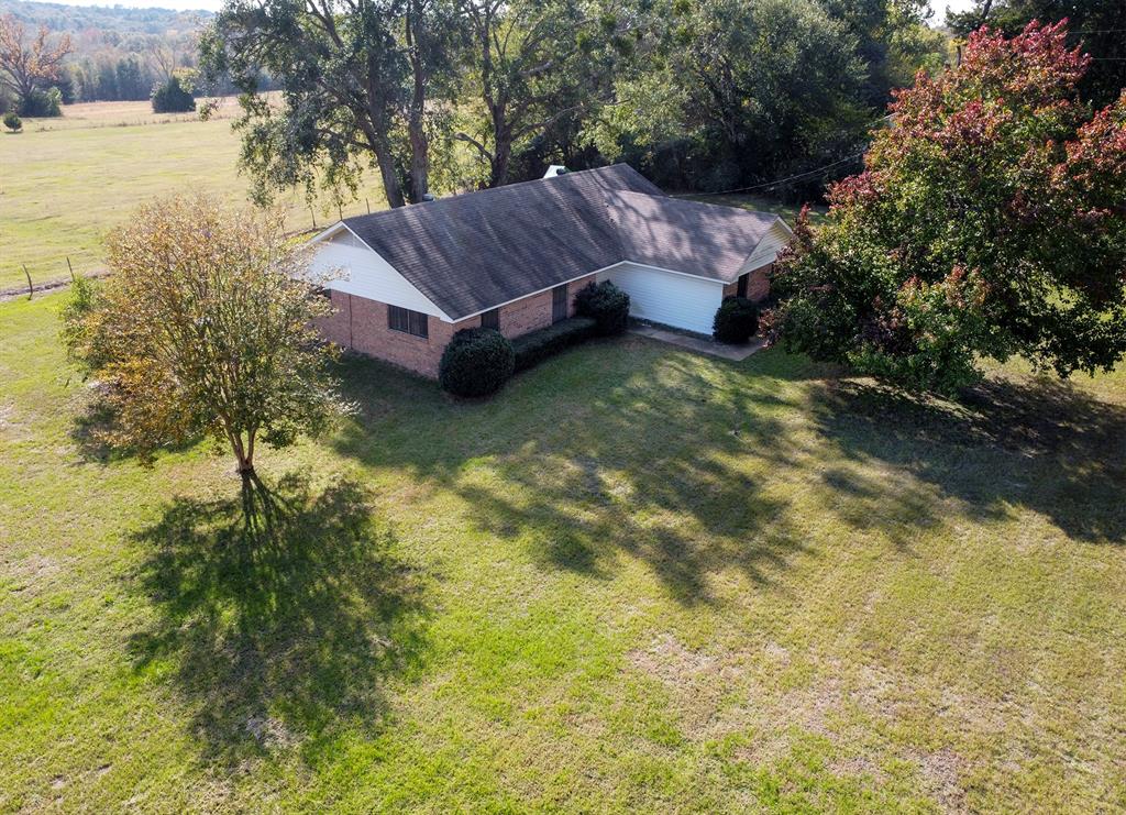 15377 County Road 1134 Tyler, TX 75709 - Photo 14 of 16 a view of a backyard with plants and lake view
