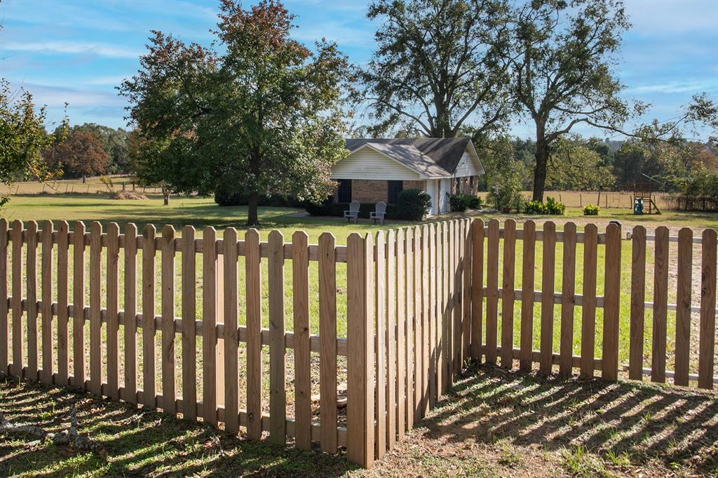 15377 County Road 1134 Tyler, TX 75709 - Photo 2 of 16 a front view of a house with a garden