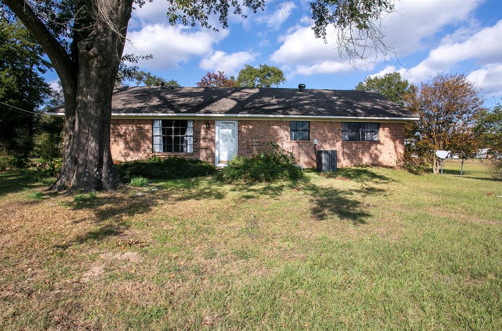 15377 County Road 1134 Tyler, TX 75709 - Photo 8 of 16 a front view of a house with a yard