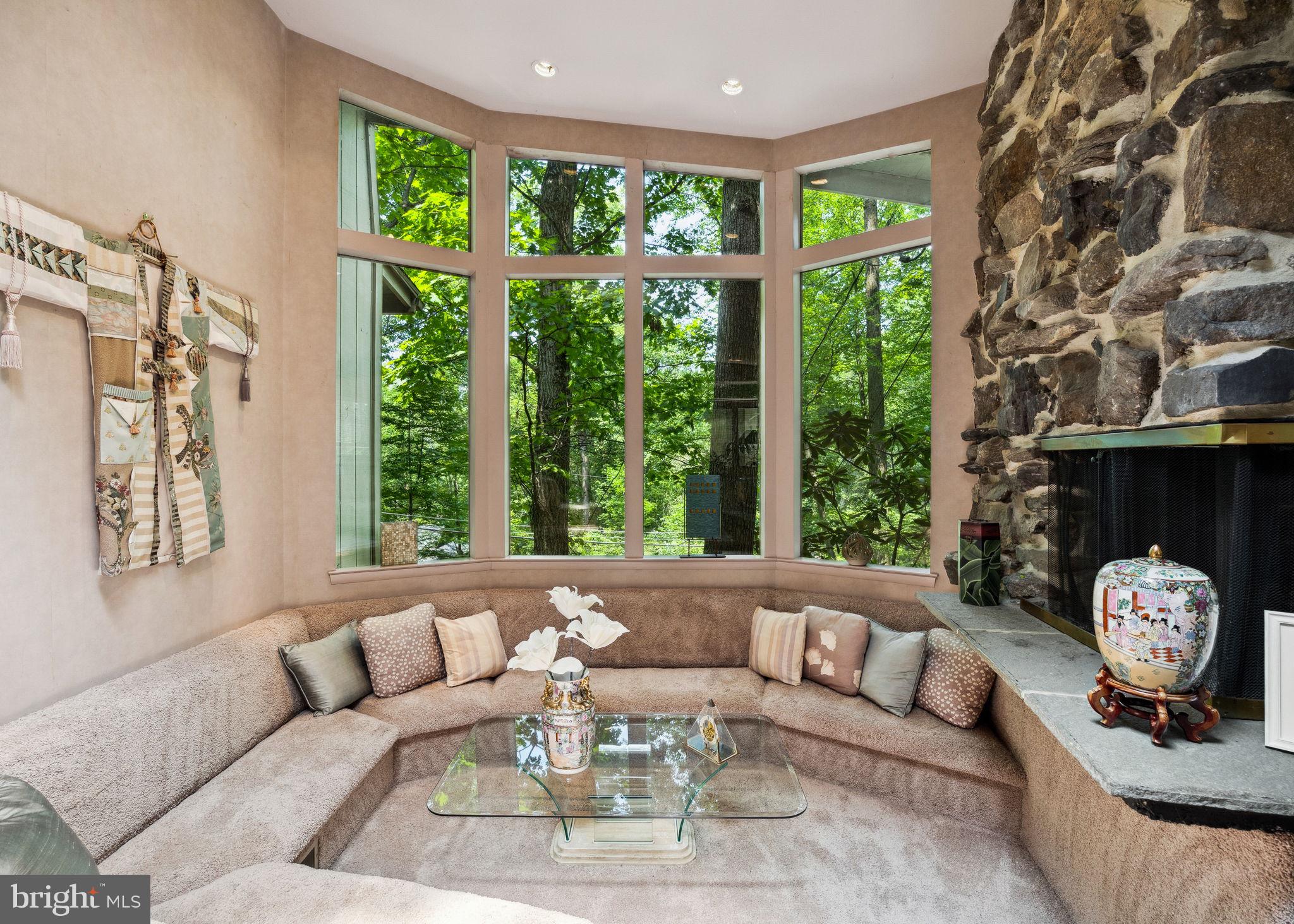 100 Pugh Road Wayne, PA 19087 - Photo 12 of 57 a living room with furniture and a large window