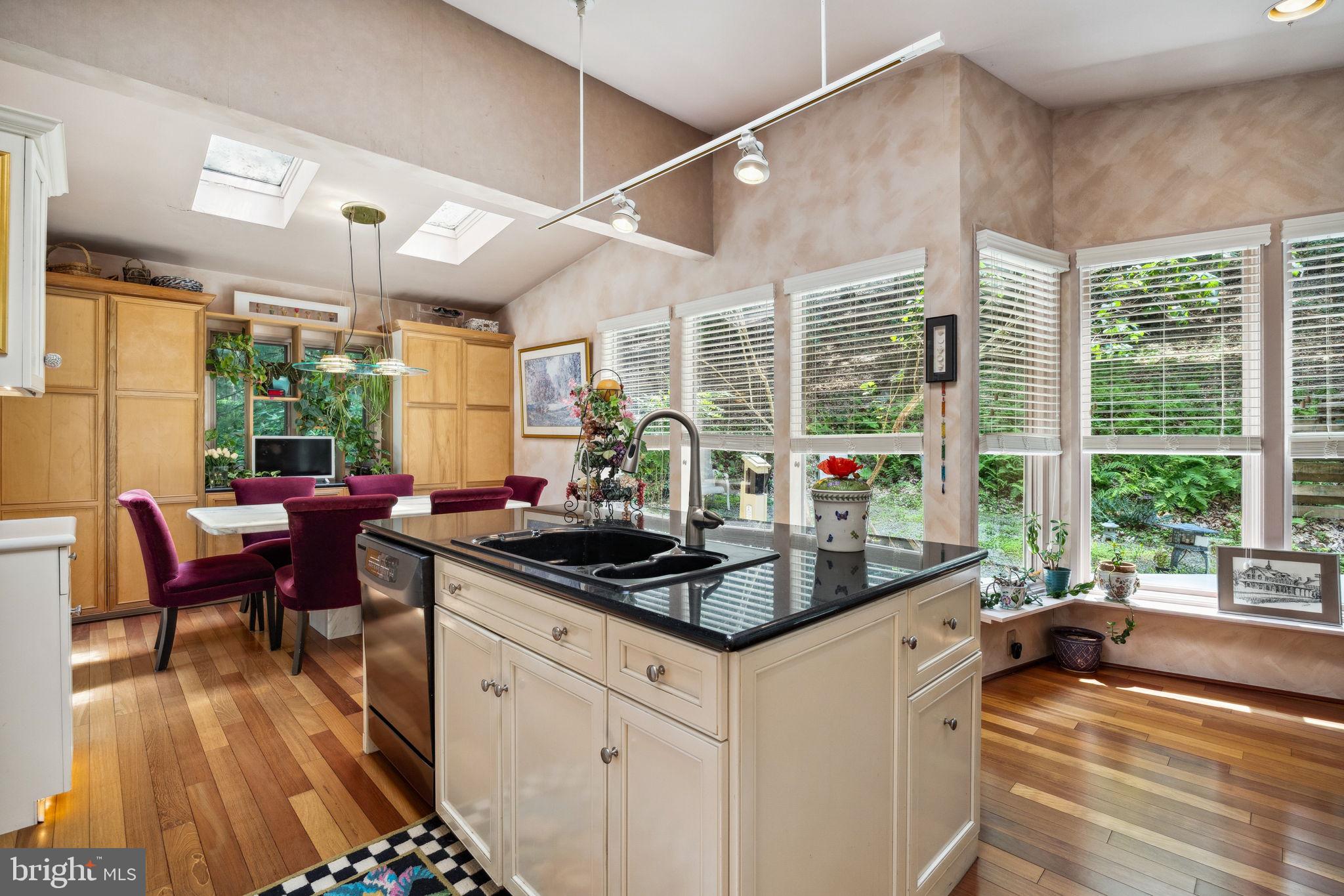 100 Pugh Road Wayne, PA 19087 - Photo 20 of 57 a kitchen with stainless steel appliances kitchen island granite countertop a stove a sink and a granite countertops with cabinets