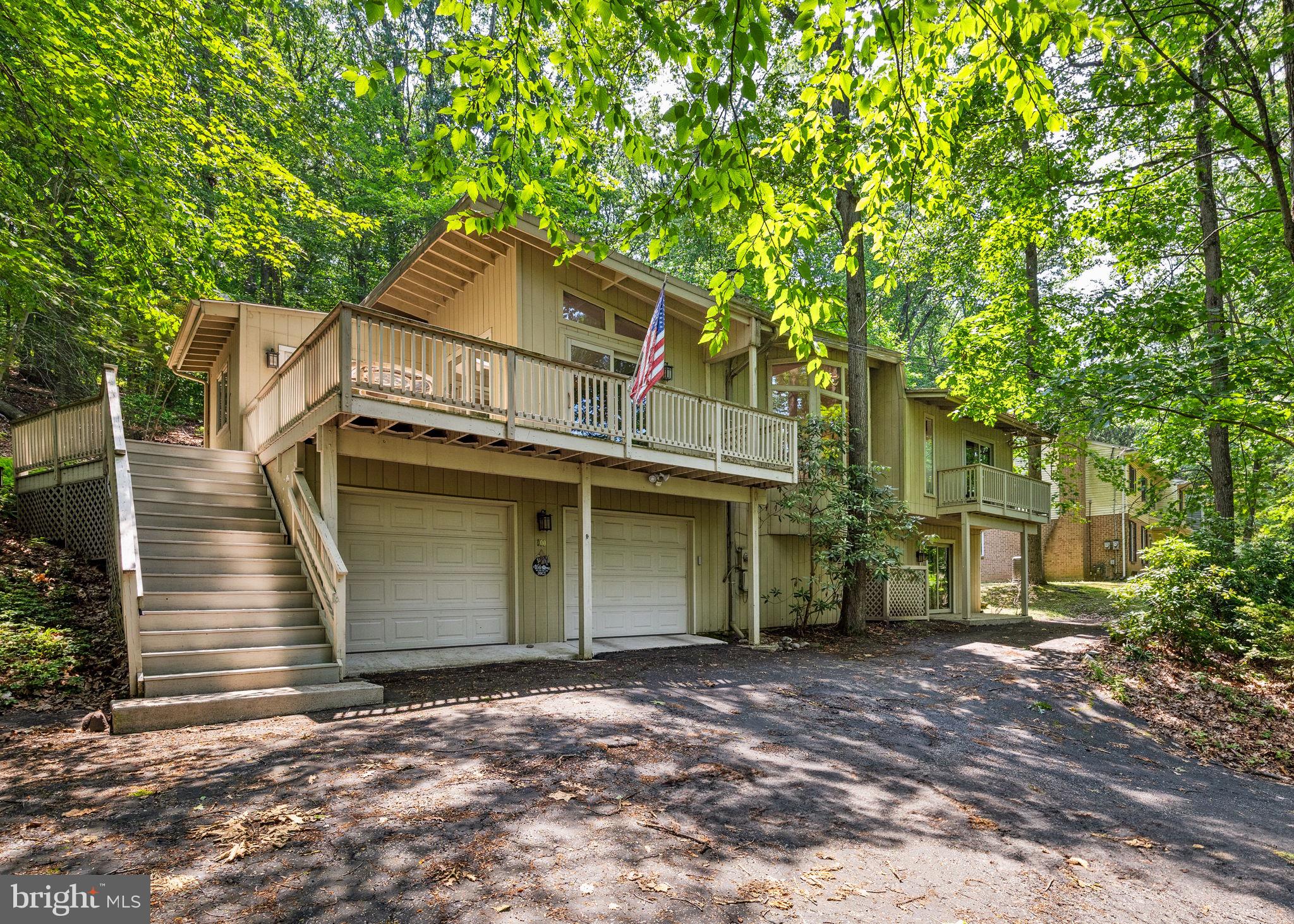 100 Pugh Road Wayne, PA 19087 - Photo 2 of 57 a front view of a house with a garage