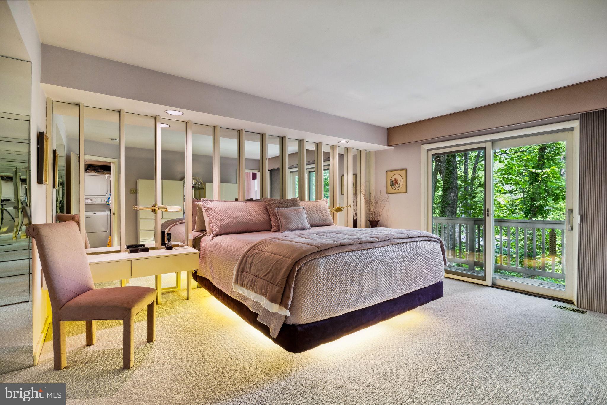 100 Pugh Road Wayne, PA 19087 - Photo 32 of 57 a spacious bedroom with a large bed and a large window