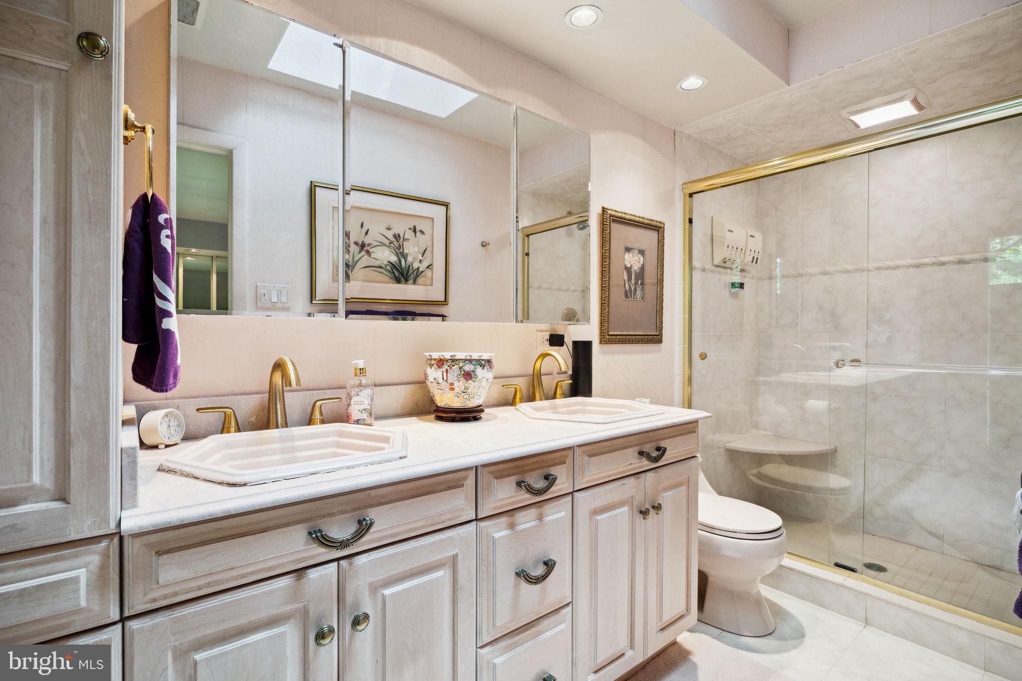 100 Pugh Road Wayne, PA 19087 - Photo 33 of 57 a bathroom with a granite countertop sink a toilet a shower and a mirror