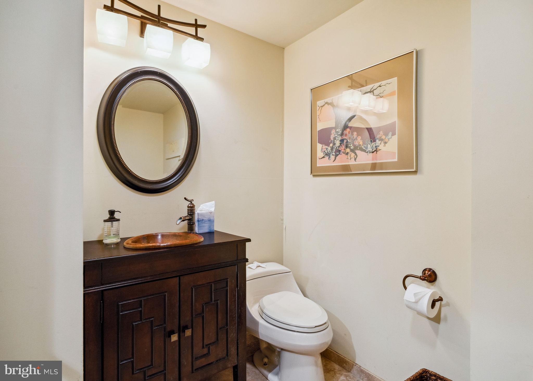 100 Pugh Road Wayne, PA 19087 - Photo 39 of 57 a bathroom with a toilet a sink and mirror