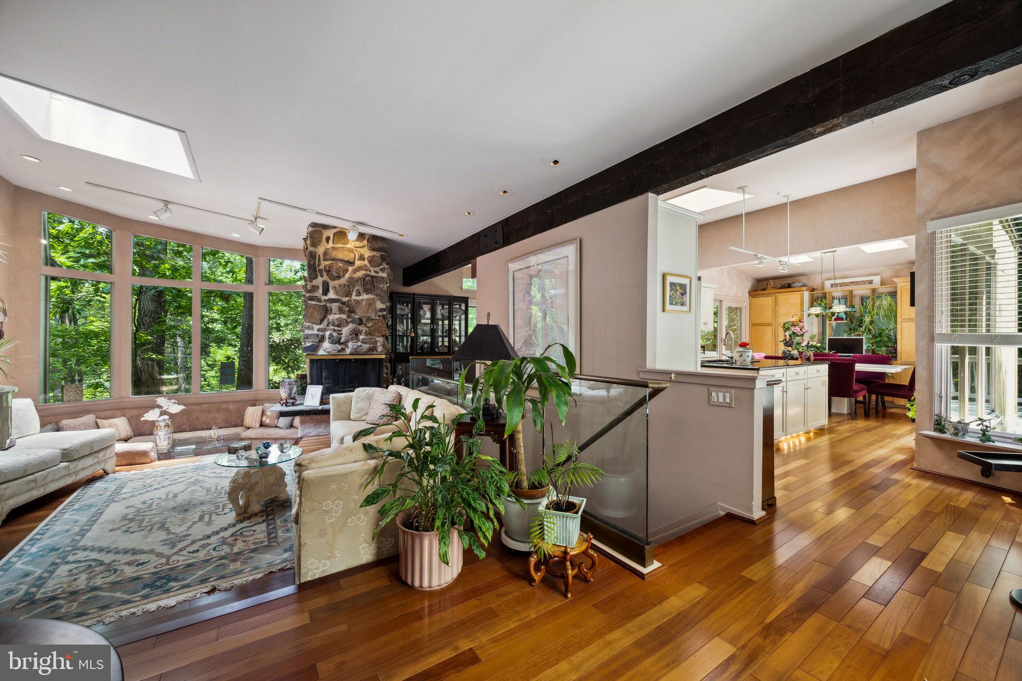 100 Pugh Road Wayne, PA 19087 - Photo 4 of 57 a living room with furniture floor to ceiling window and wooden floor