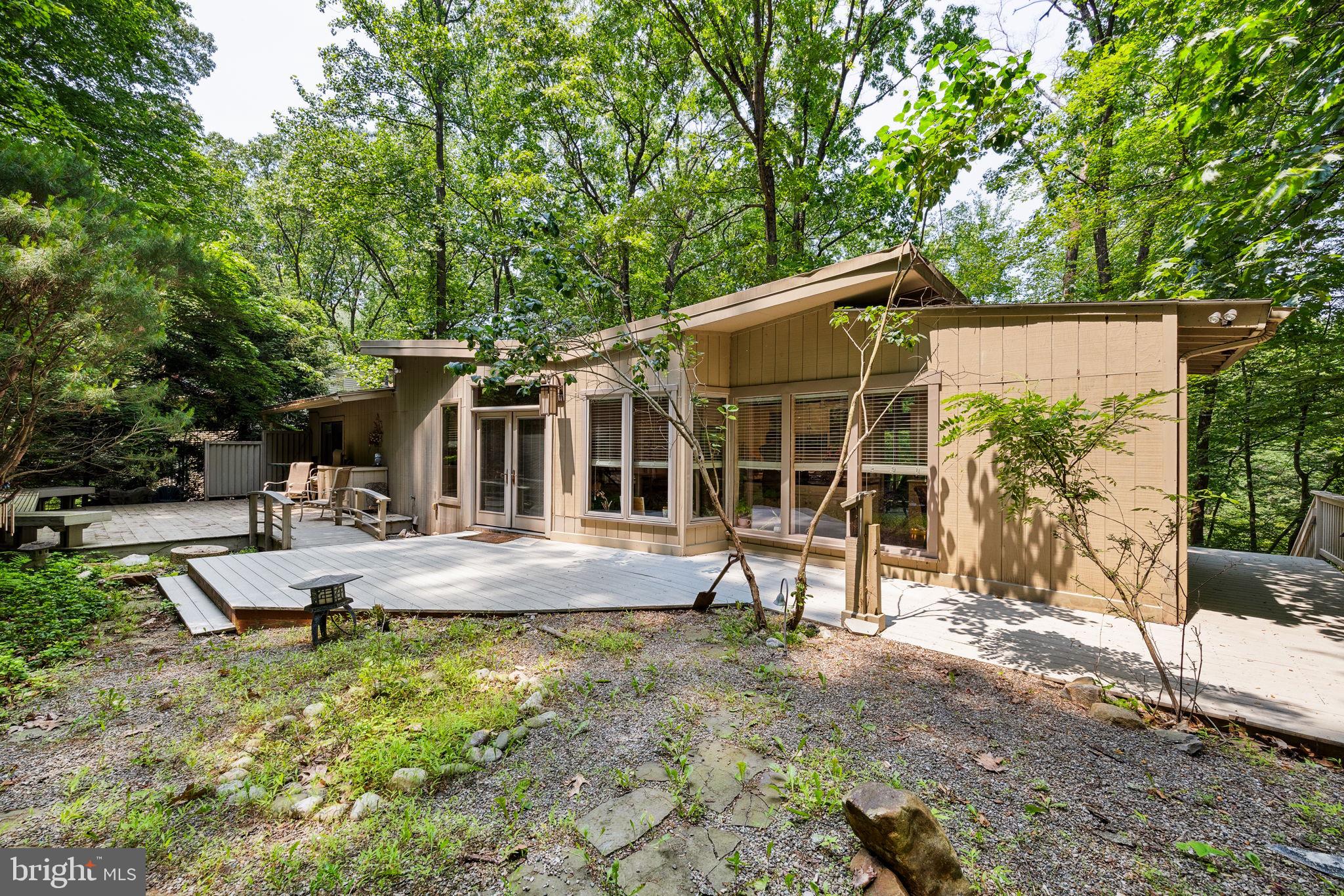 100 Pugh Road Wayne, PA 19087 - Photo 44 of 57 a view of a house with backyard porch and sitting area