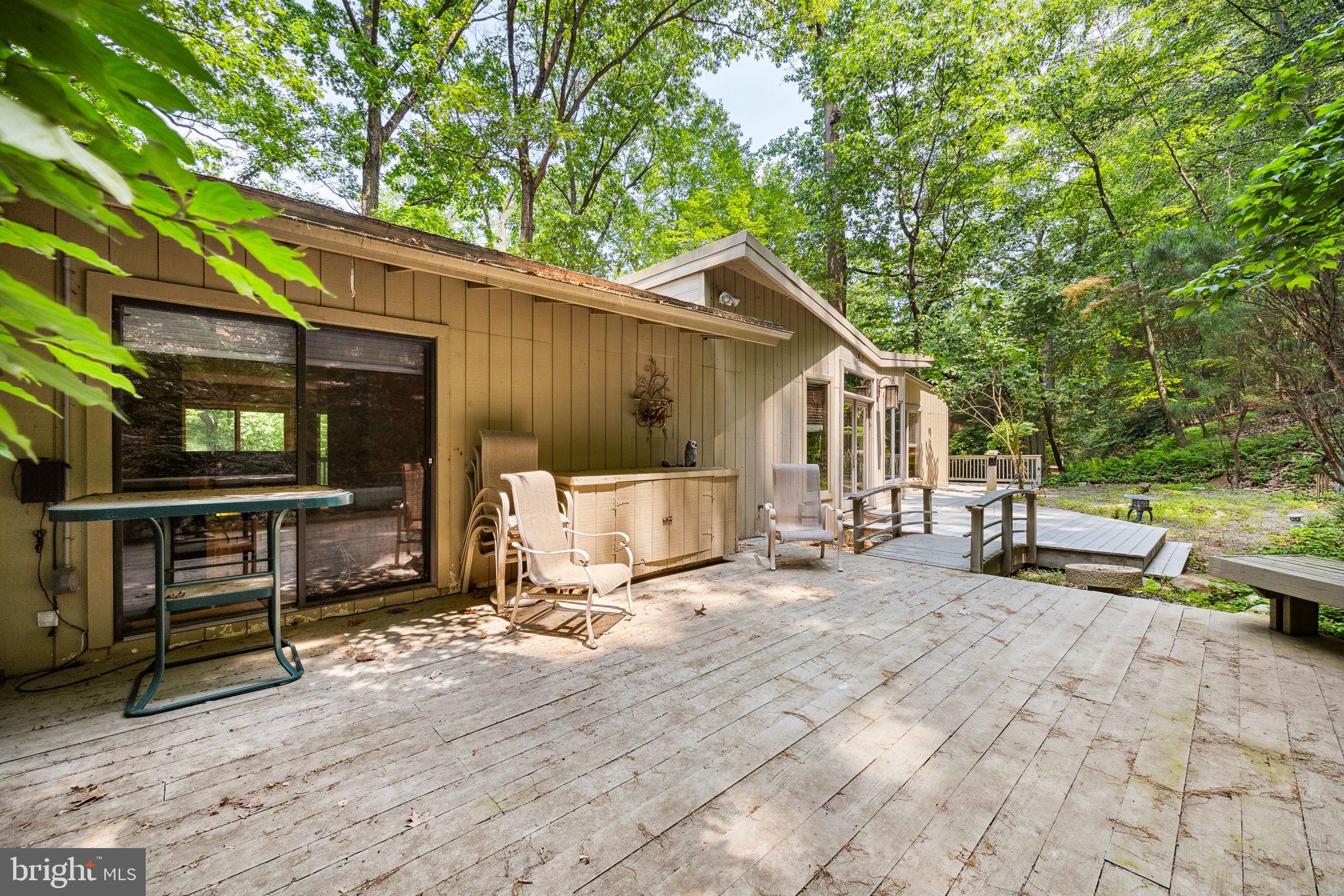 100 Pugh Road Wayne, PA 19087 - Photo 47 of 57 a view of a house with backyard and sitting area